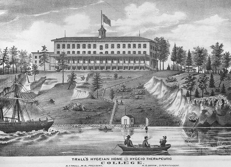 "Trall's Hygeian Home and Hygeio Therapeutic College" (Florence) (1876). New Jersey-born doctor Russell Thacher Trall (1812–1877) was a leading proponent of hydropathy and vegetarianism in the treatment of illness. He is recognized today as a pioneer of "natural hygiene," a controversial, anti-drug method of medical practice. He published numerous works—from pamphlets to cookbooks to an encyclopedia—and put his theories to practice in a large treatment/training center that he built in New Jersey. The site of Trall's facility was on the Delaware River side of Front Street in Florence, between Oak Street and Cedar Street. The area is now an overgrown forest.