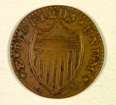 New Jersey's first state coin (first minted in 1786) [Numismatics Collection]. Taken from Pierre Eugene du Simitiere's state seal design, the horse and the plow were obvious image choices for this 1/15 shilling copper piece. The coin was the first to formally adopt the national motto "E Pluribus Unum" (one from many), which still appears on all U.S. coins. (Left: Obverse, Right: Reverse)