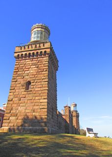 2013: Twin Lights of the Navesink Lighthouse. The current non-identical towers were built in 1862 from local brownstone. At night, one light is fixed; the other flashes.